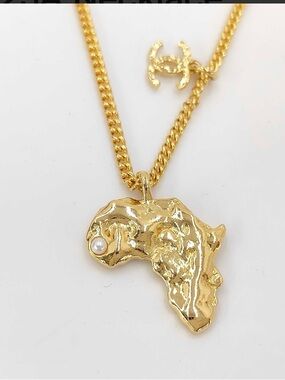 CHANEL Gold-Tone Africa Map Pendant Necklace with Pearl Detail